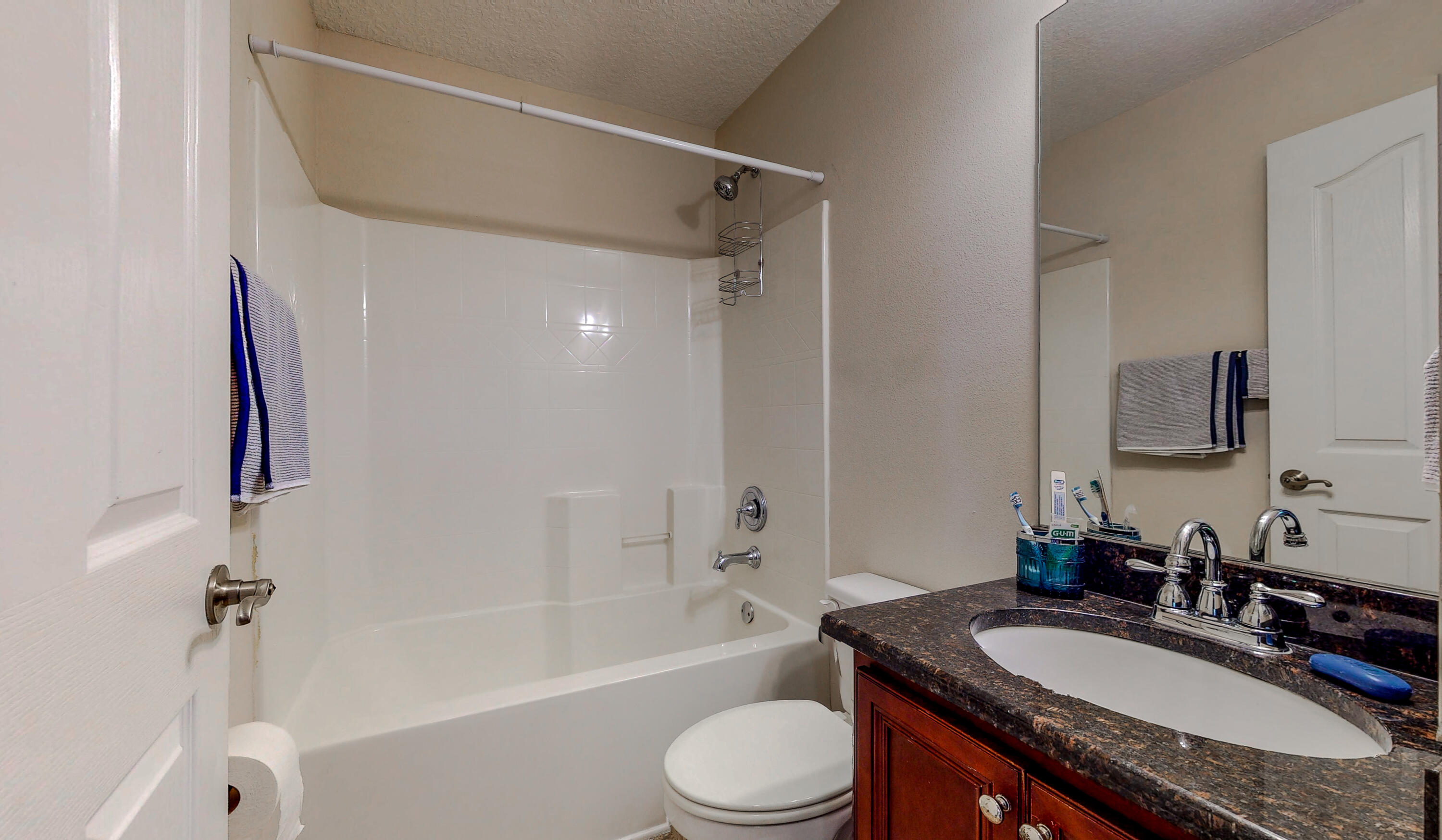 23 Beacon Point Drive Santa Rosa Beach, FL 32459 - Photo 16 of 33 a bathroom with a granite countertop sink toilet tub and shower