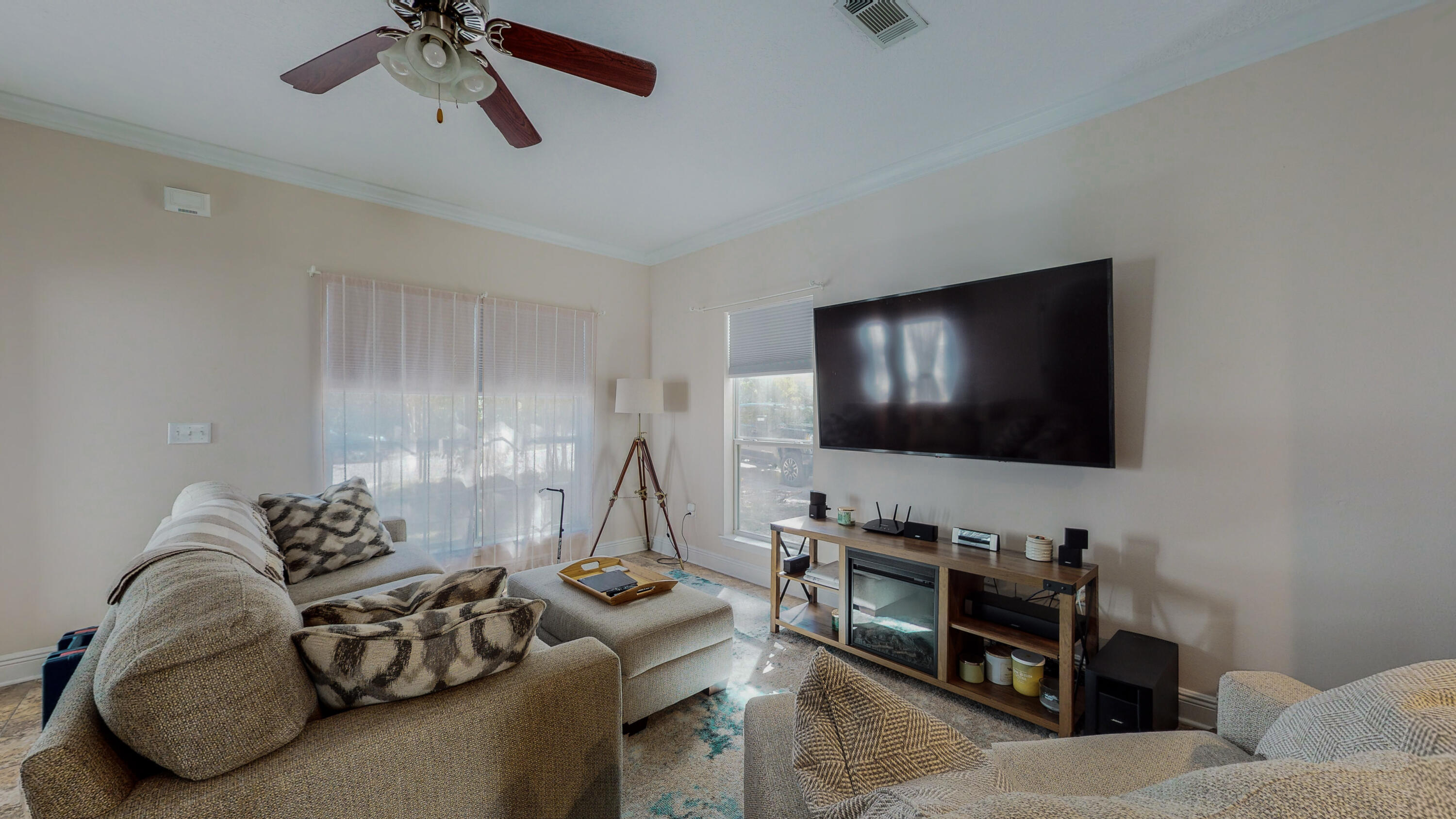 23 Beacon Point Drive Santa Rosa Beach, FL 32459 - Photo 5 of 33 a living room with furniture and a flat screen tv