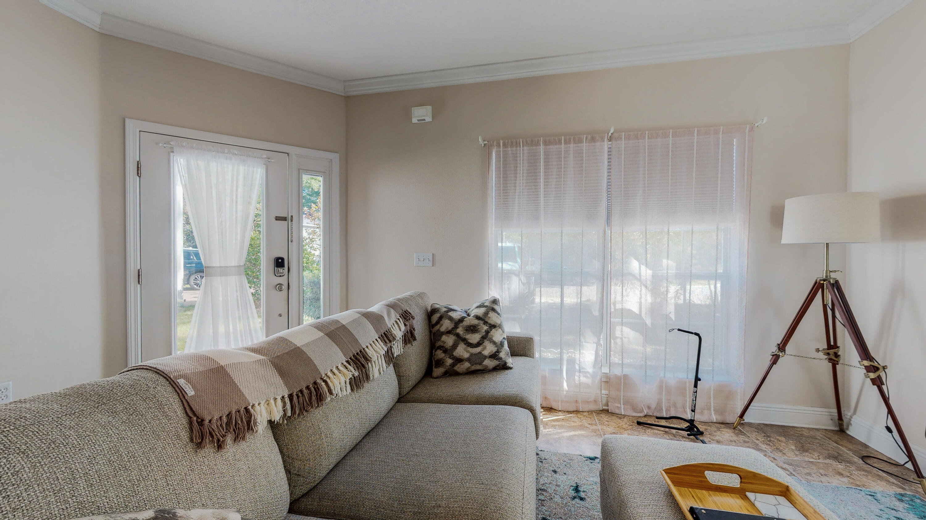 23 Beacon Point Drive Santa Rosa Beach, FL 32459 - Photo 7 of 33 a living room with a couch and a floor to ceiling window