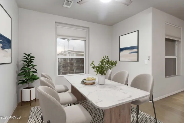 a dining room with furniture and window