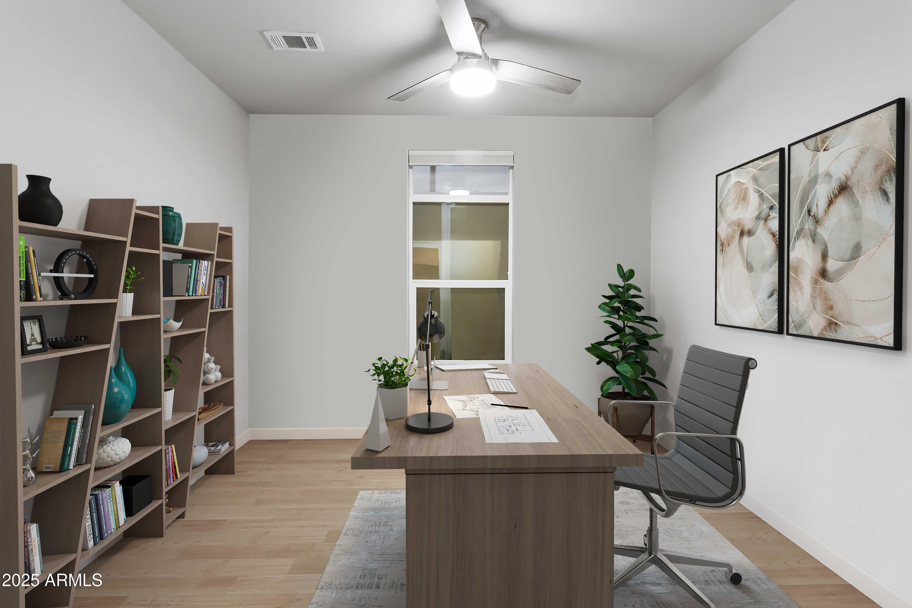 2727 East University Drive, Unit 146 Tempe, AZ 85288 - Photo 13 of 36 a view of a workspace with furniture and book shelf