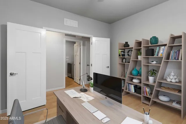 a reading room with furniture and a book shelf