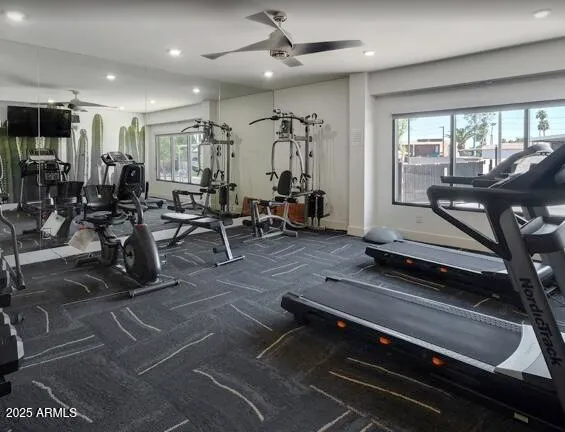 a living room with lots of furniture and a large window