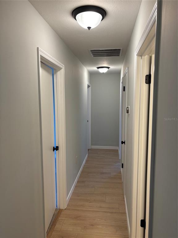 9801 Southeast Sunset Harbor Road Summerfield, FL 34491 - Photo 18 of 37 a view of hallway