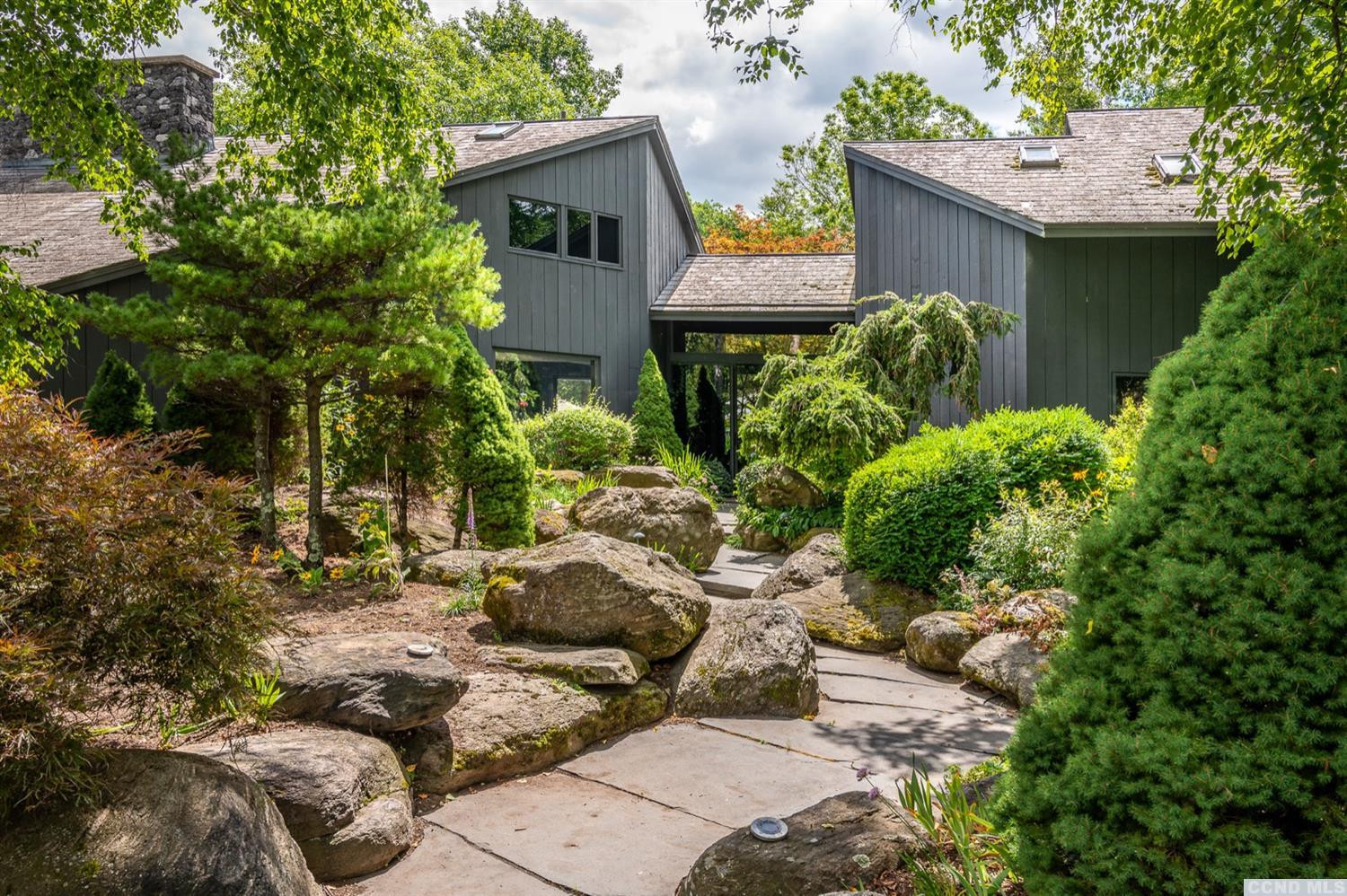 181 Golf Course Road Hillsdale, NY 12529 - Photo 11 of 44 a view of backyard of house with outdoor seating and green space