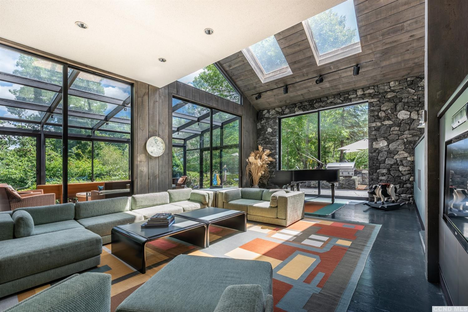 181 Golf Course Road Hillsdale, NY 12529 - Photo 14 of 44 a living room with furniture a fireplace and a large window