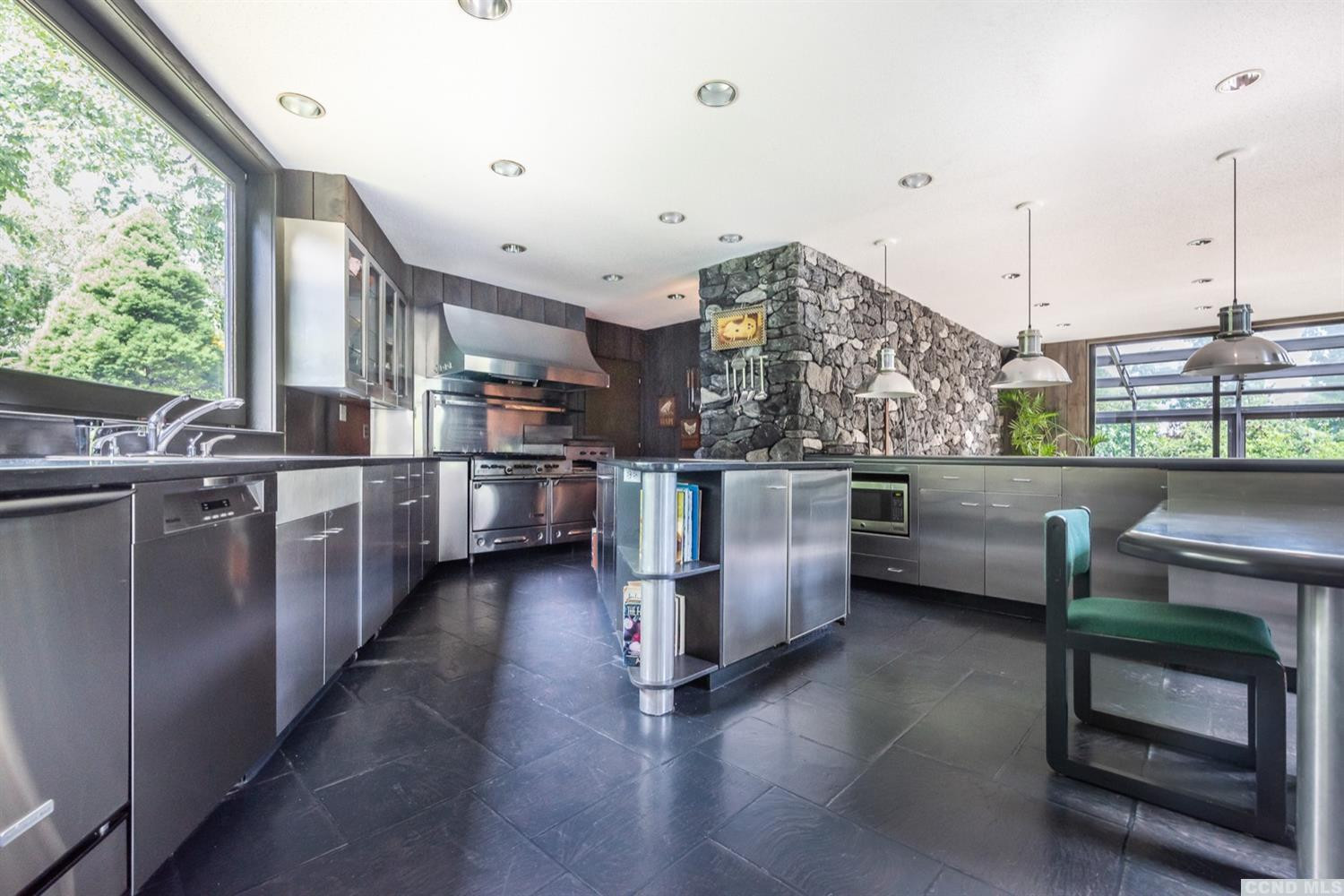 181 Golf Course Road Hillsdale, NY 12529 - Photo 17 of 44 a kitchen with stainless steel appliances kitchen island granite countertop a stove a sink and a refrigerator