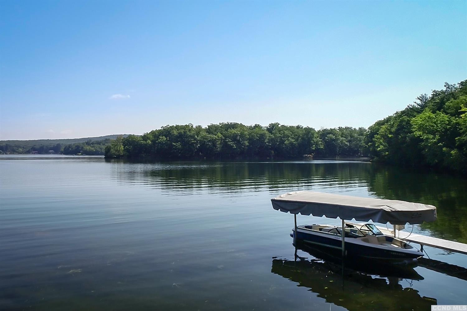 181 Golf Course Road Hillsdale, NY 12529 - Photo 37 of 44 a view of a lake with a mountain in the background