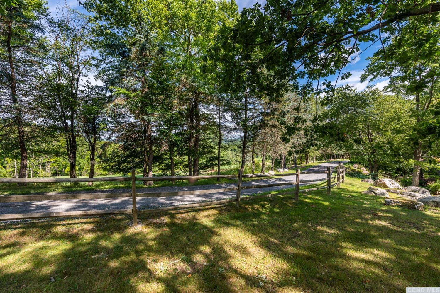 181 Golf Course Road Hillsdale, NY 12529 - Photo 10 of 44 a backyard of a house with table and chairs