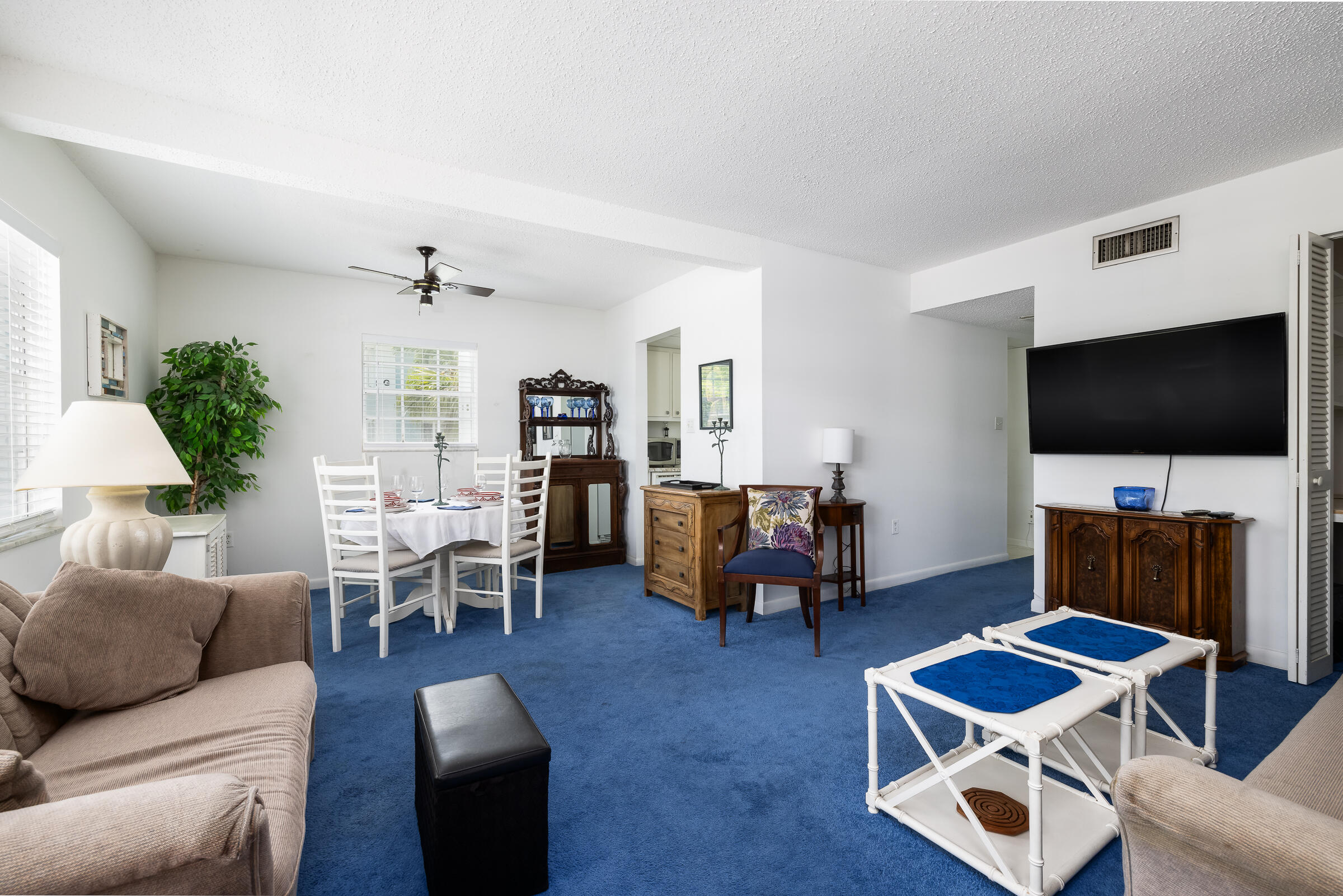 40 High Point Road, Unit A101 Tavernier, FL 33070 - Photo 4 of 29 a living room with furniture and a flat screen tv