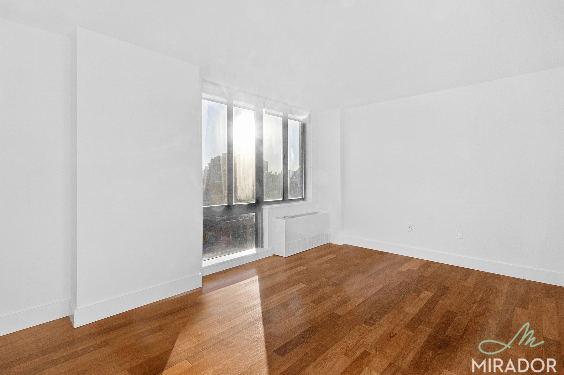 290 3rd Avenue, Unit 28C Manhattan, NY 10010 - Photo 12 of 28 a view of an empty room and wooden floor