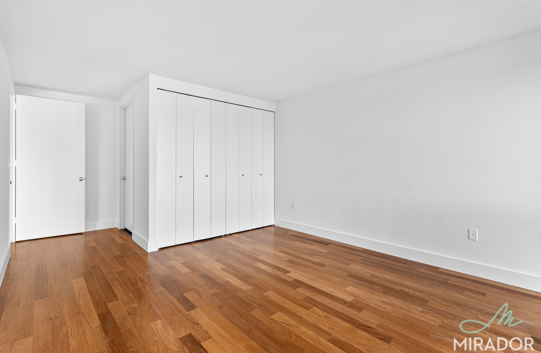 290 3rd Avenue, Unit 28C Manhattan, NY 10010 - Photo 13 of 28 a view of an empty room with wooden floor