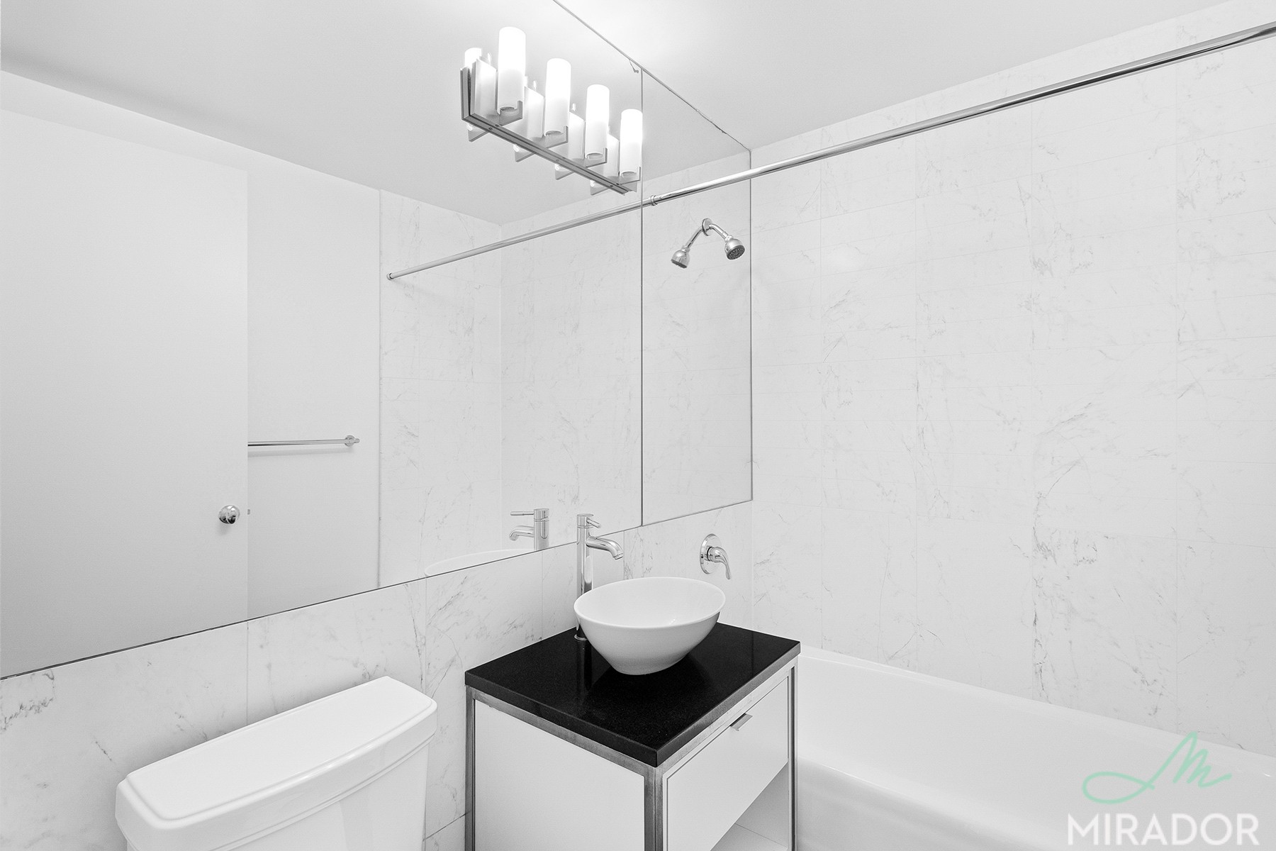 290 3rd Avenue, Unit 28C Manhattan, NY 10010 - Photo 15 of 28 a bathroom with a sink a toilet and shower