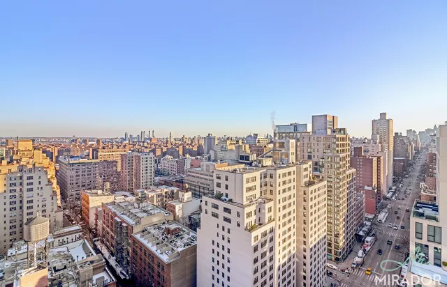 a view of a city with tall buildings