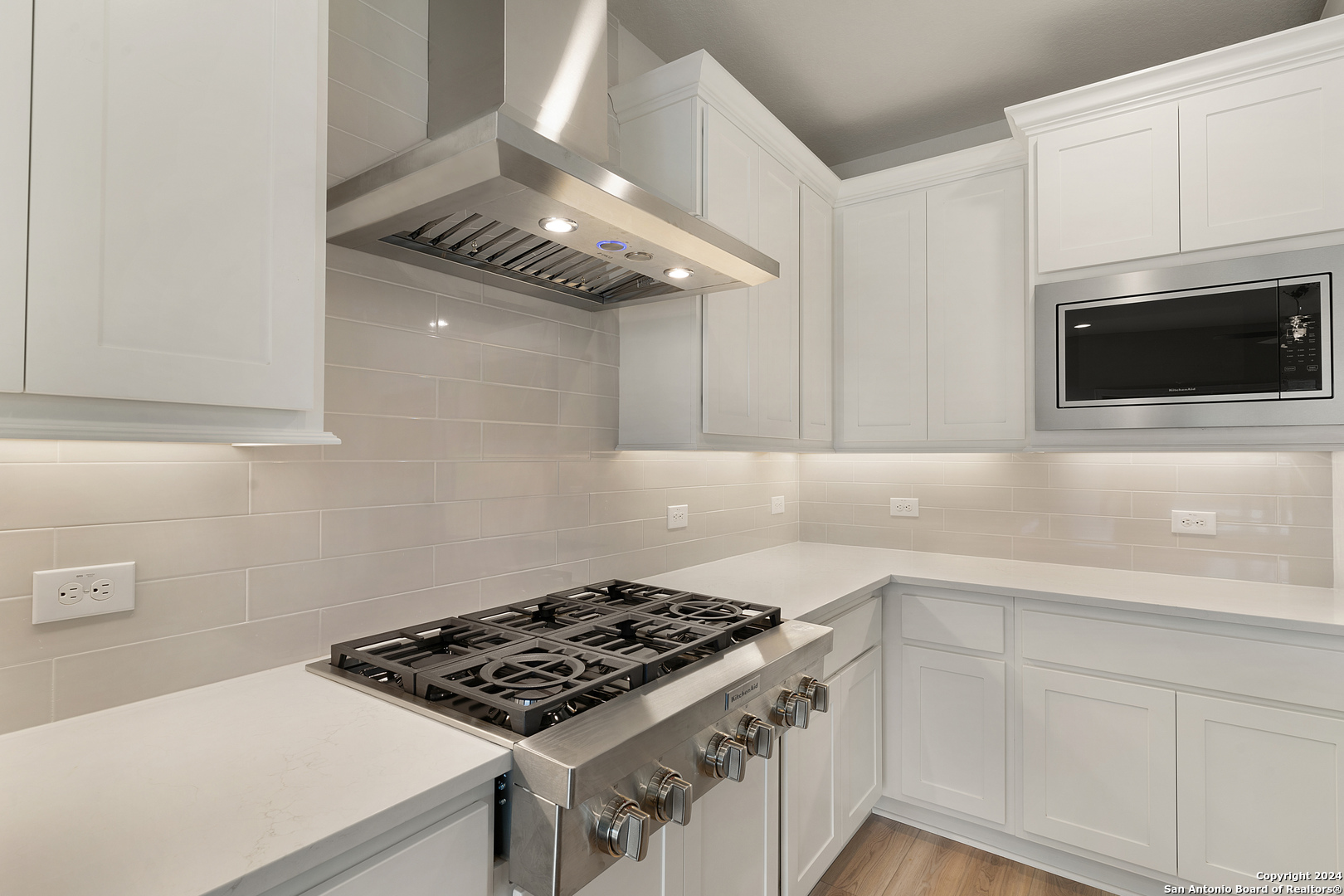 948 Nolte Bend Seguin, TX 78155 - Photo 11 of 39 a kitchen with a stove and a microwave