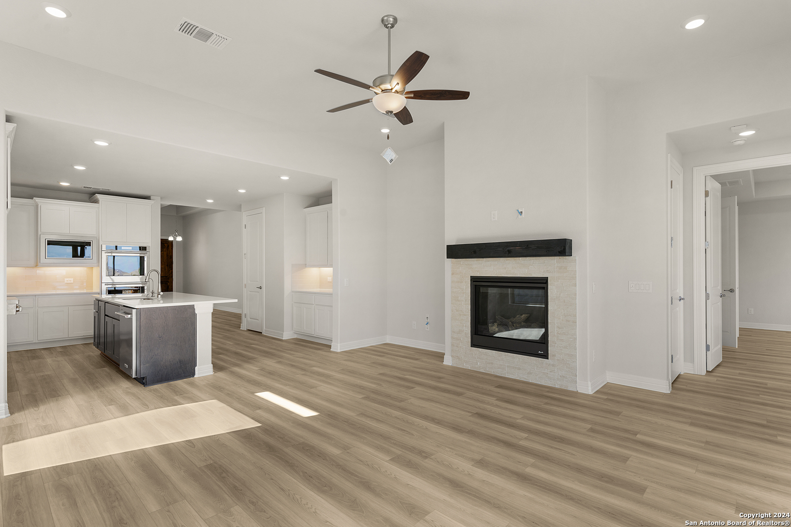 948 Nolte Bend Seguin, TX 78155 - Photo 16 of 39 a view of a kitchen with a sink and a fireplace