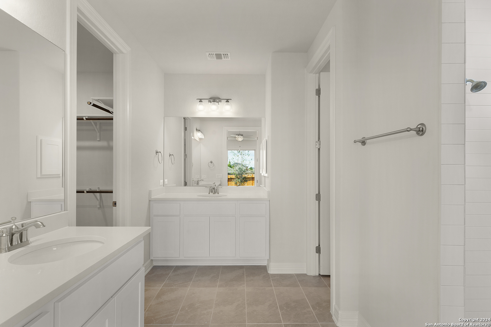 948 Nolte Bend Seguin, TX 78155 - Photo 19 of 39 a spacious bathroom with a granite countertop sink mirror and bathtub