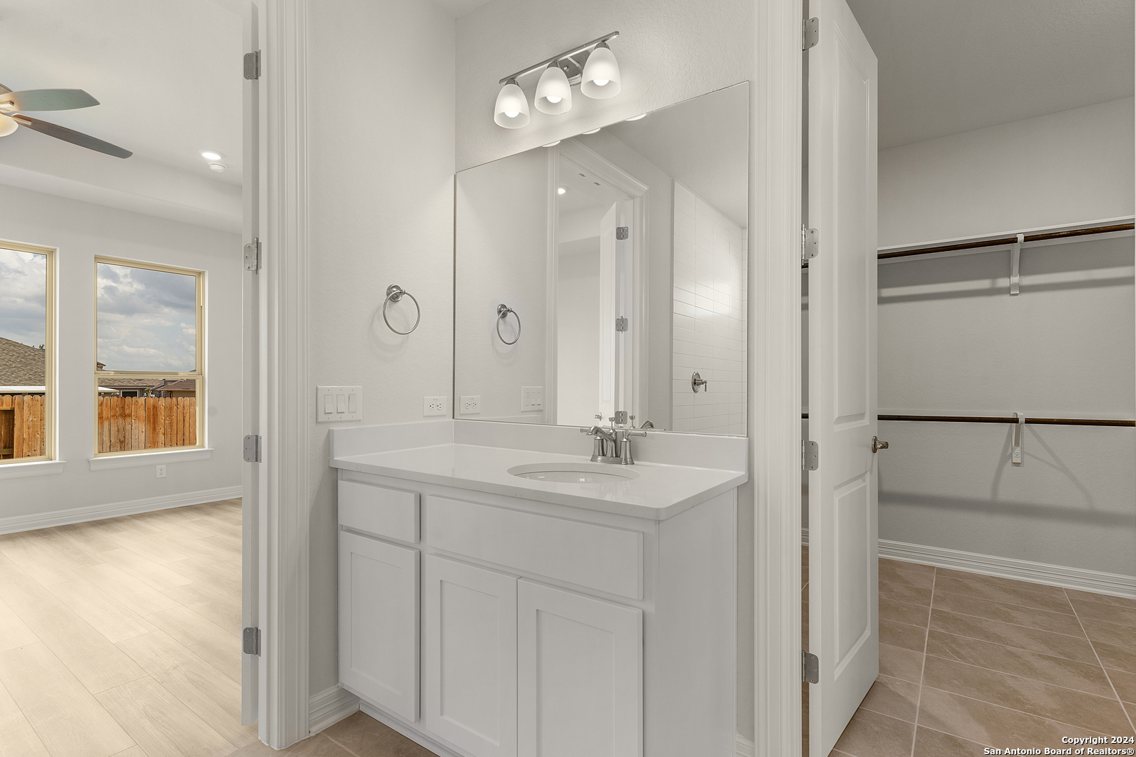 948 Nolte Bend Seguin, TX 78155 - Photo 21 of 39 a bathroom with a double vanity sink mirror and shower