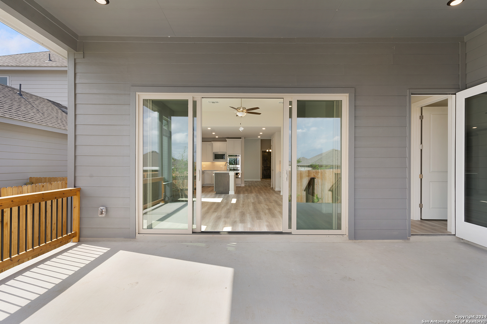 948 Nolte Bend Seguin, TX 78155 - Photo 28 of 39 wooden floor in a hall with a livingroom