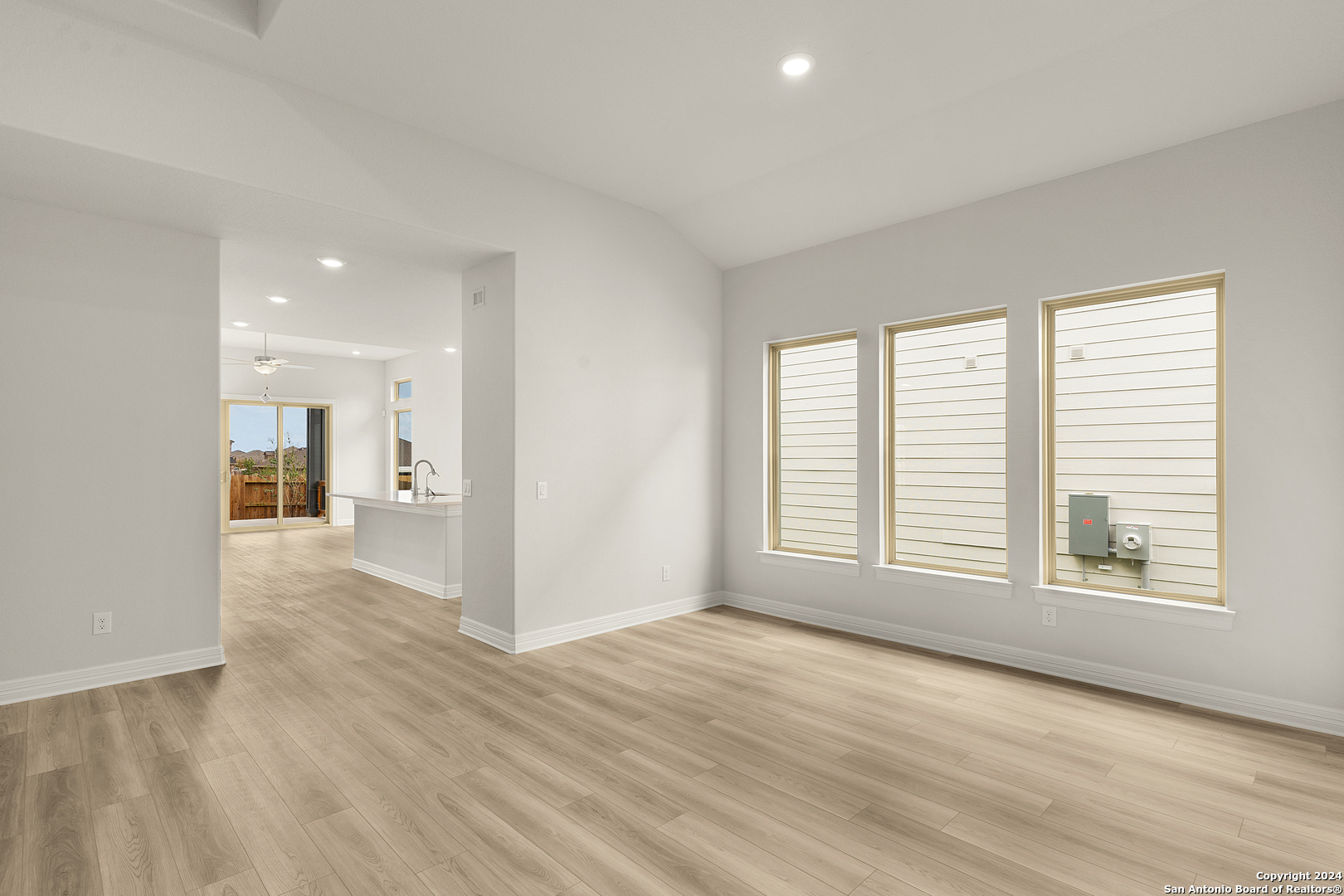 948 Nolte Bend Seguin, TX 78155 - Photo 5 of 39 wooden floor in an empty room with a window