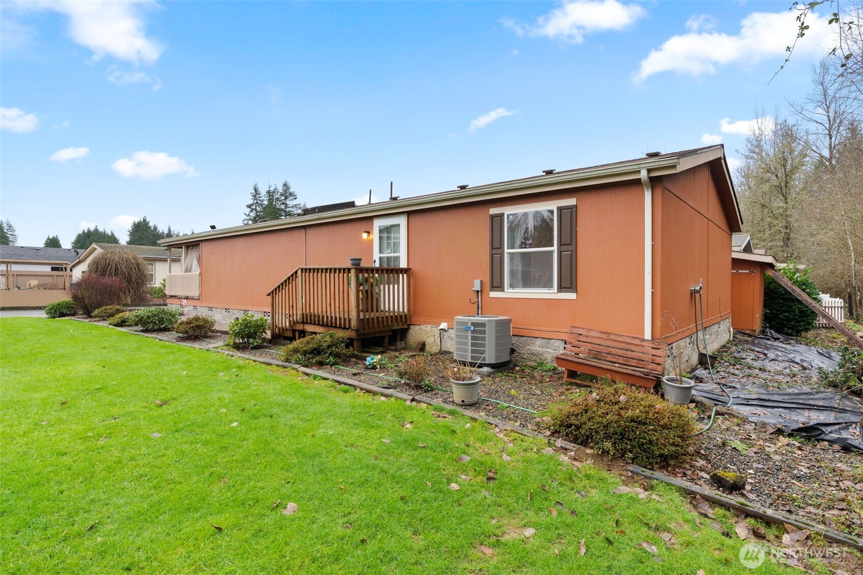 1101 South Scheuber Road, Unit 18 Centralia, WA 98531 - Photo 26 of 28 a backyard of a house with table and chairs