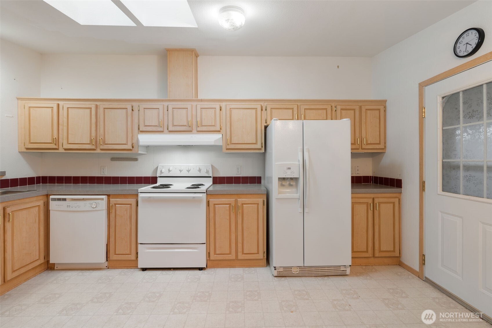 1101 South Scheuber Road, Unit 18 Centralia, WA 98531 - Photo 9 of 28 a kitchen with stainless steel appliances granite countertop a refrigerator and cabinets