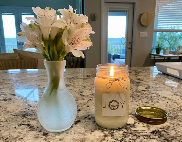 a vase of flowers sitting on a table