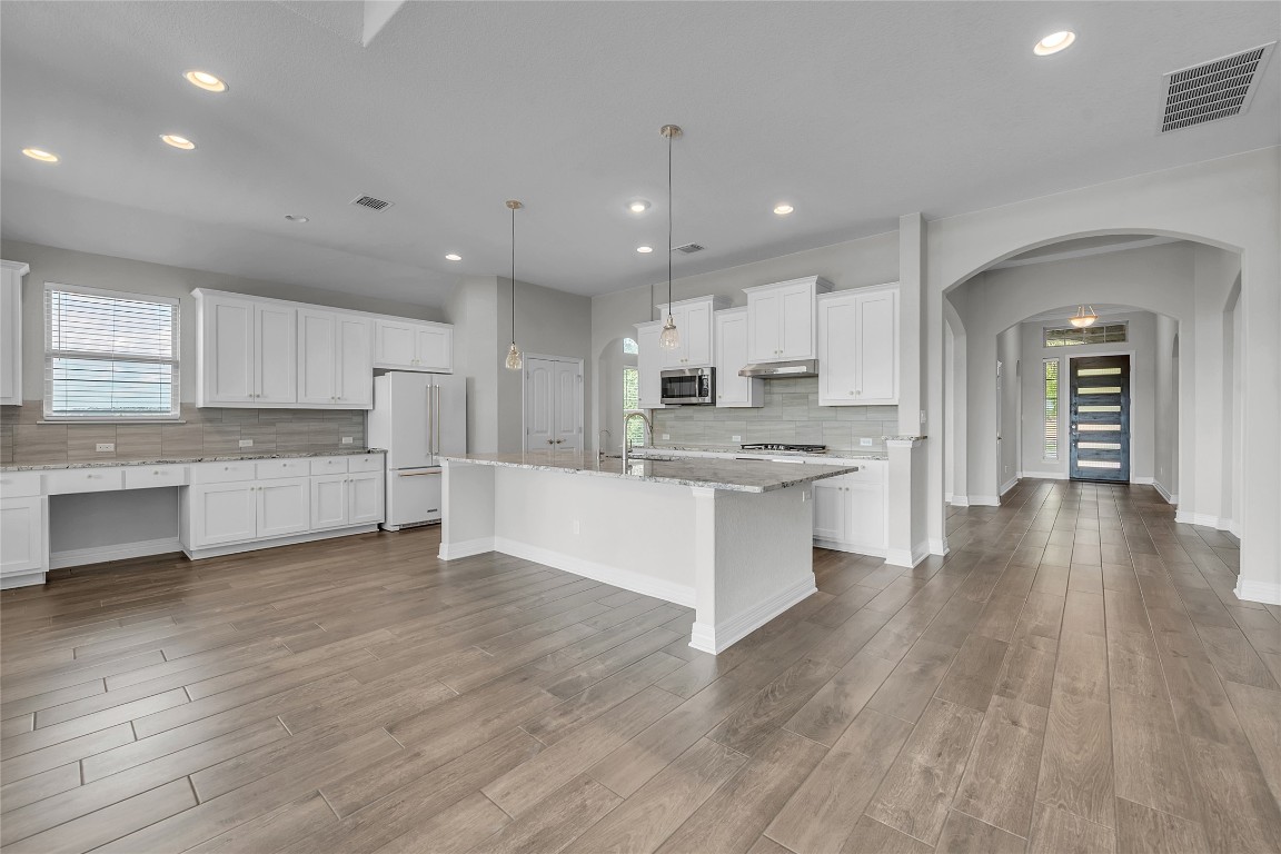 221 Cibolo Ridge Drive Georgetown, TX 78628 - Photo 12 of 27 a view of kitchen with cabinets and wooden floor