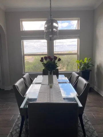 a view of a dining room with furniture window and outside view