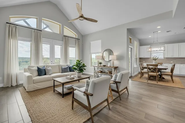 a living room with furniture and wooden floor