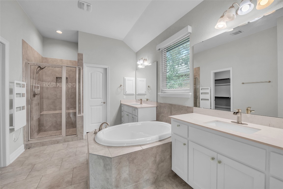 221 Cibolo Ridge Drive Georgetown, TX 78628 - Photo 19 of 27 a bathroom with a sink a toilet a large mirror and shower