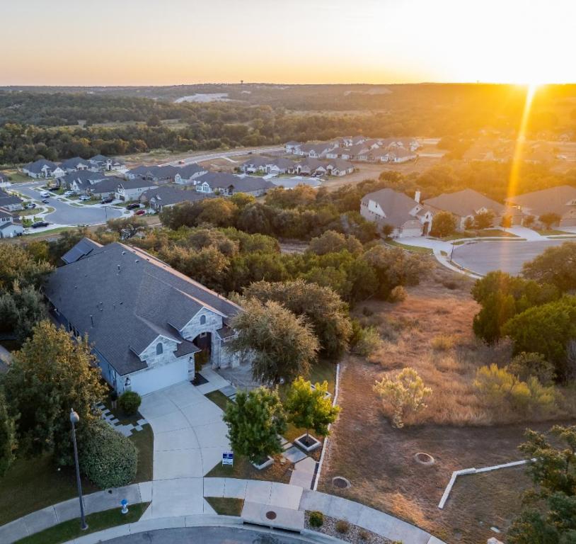 221 Cibolo Ridge Drive Georgetown, TX 78628 - Photo 2 of 27 an aerial view of residential houses with outdoor space