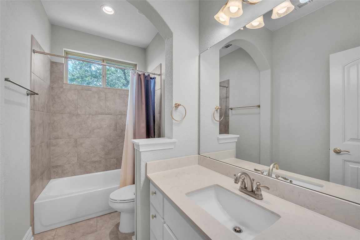 221 Cibolo Ridge Drive Georgetown, TX 78628 - Photo 21 of 27 a bathroom with a sink toilet tub and shower