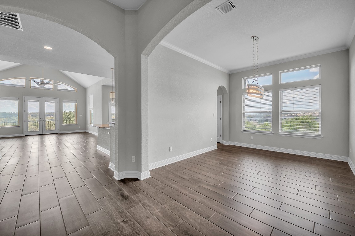 221 Cibolo Ridge Drive Georgetown, TX 78628 - Photo 22 of 27 an empty room with wooden floor and windows