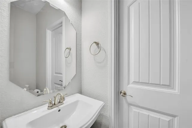 a bathroom with a sink and vanity