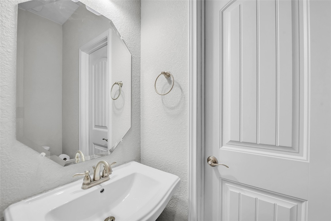 221 Cibolo Ridge Drive Georgetown, TX 78628 - Photo 24 of 27 a bathroom with a sink and vanity