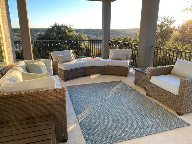 a balcony with furniture and a couch