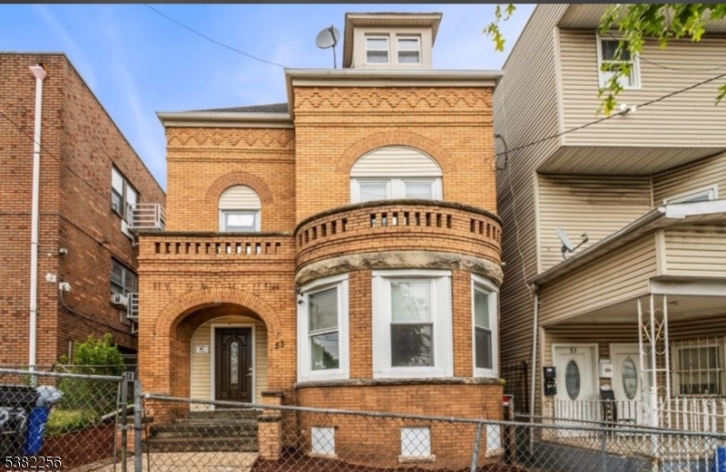 a front view of a house with a balcony