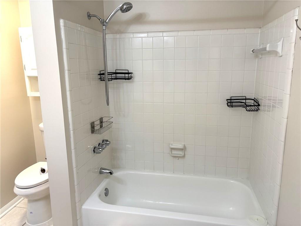 504 Wynnes Ridge Circle Southeast Marietta, GA 30067 - Photo 16 of 21 a bathroom with a bathtub and a shower