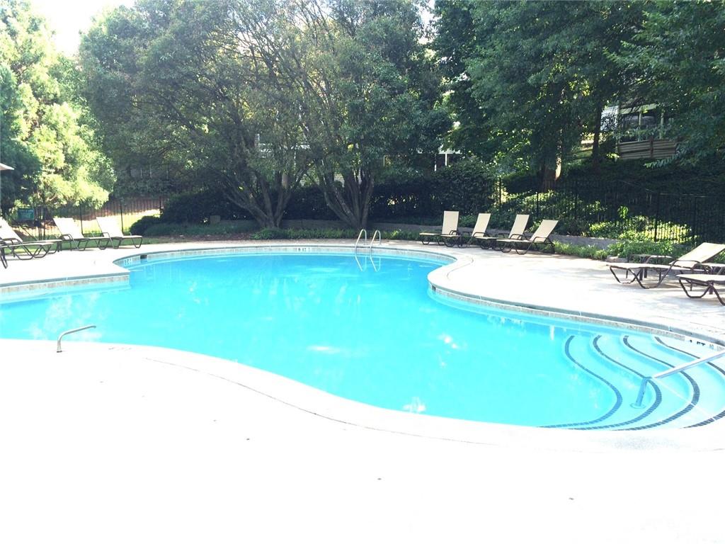 504 Wynnes Ridge Circle Southeast Marietta, GA 30067 - Photo 20 of 21 a view of a swimming pool with a yard