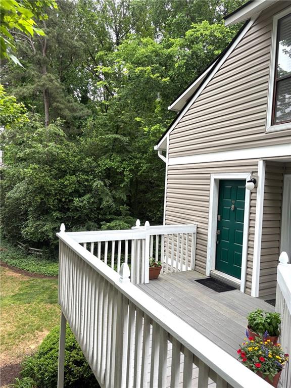 504 Wynnes Ridge Circle Southeast Marietta, GA 30067 - Photo 2 of 21 a view of a wooden deck and a yard with green space