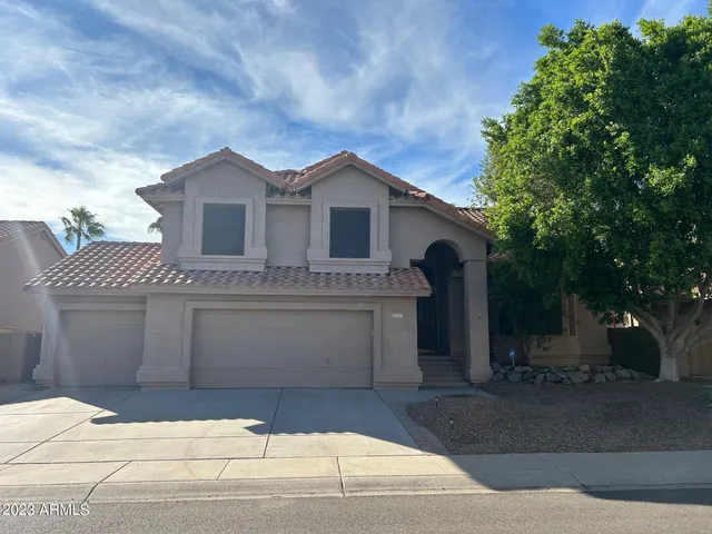 a front view of a house with a garage