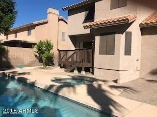 a view of a swimming pool with a yard