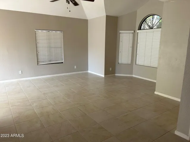 a view of an empty room with windows