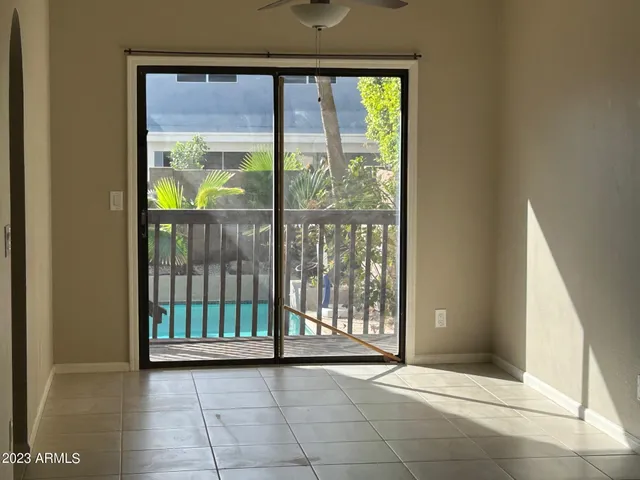 a view of empty room with floor to ceiling window