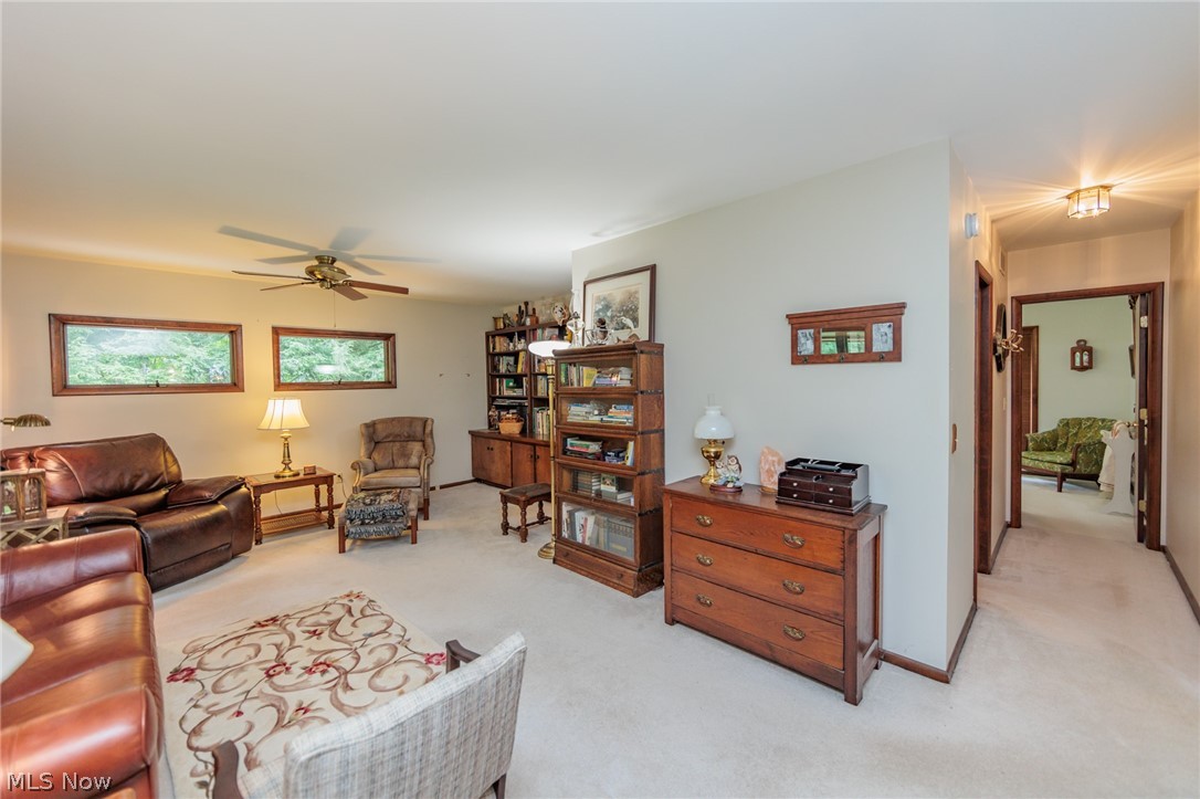 425 Bittersweet Road Akron, OH 44333 - Photo 16 of 50 Living room with light colored carpet and ceiling fan