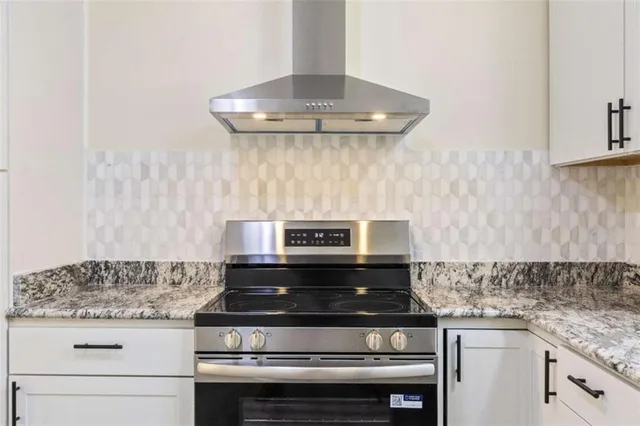 wooden floor in an empty room and a kitchen