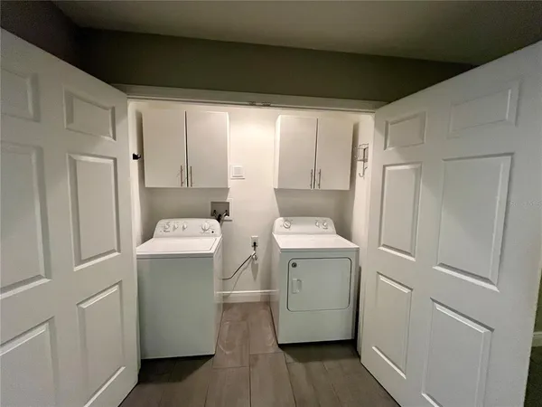 a utility room with dryer and washer