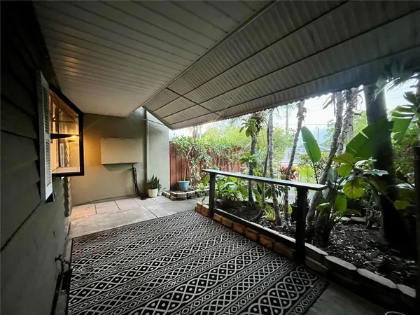 a balcony view with a potted plant on a table