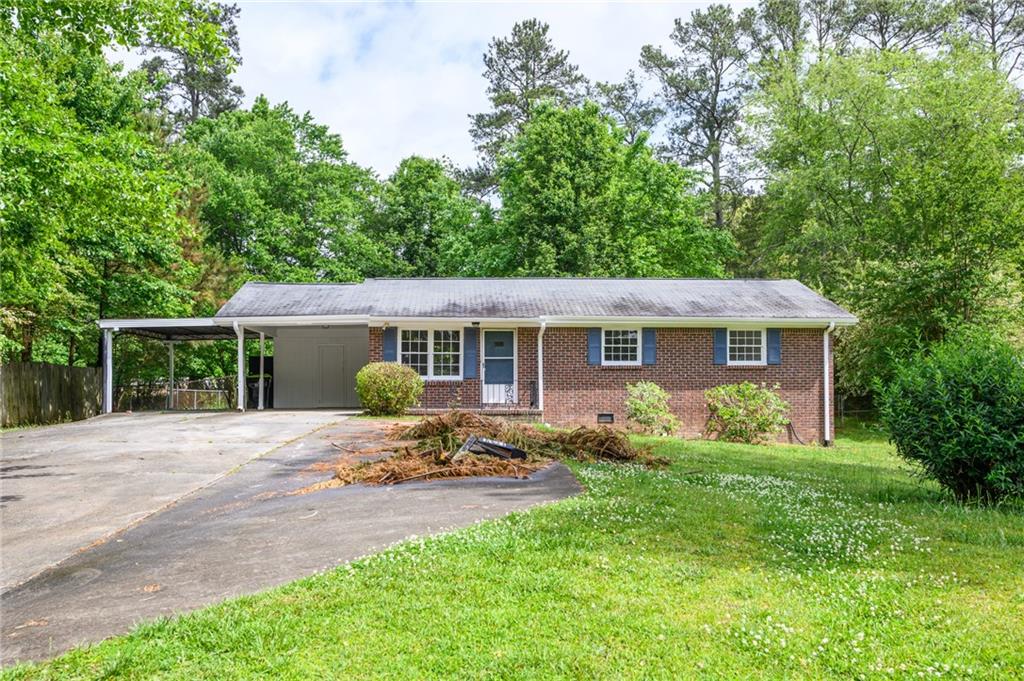 1131 Rochelle Drive Austell, GA 30168 - Photo 1 of 1 a front view of house with yard and green space